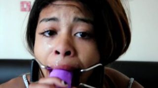 Ahegao girl in open mouth gag deepthroats dildo and spits on face and tits